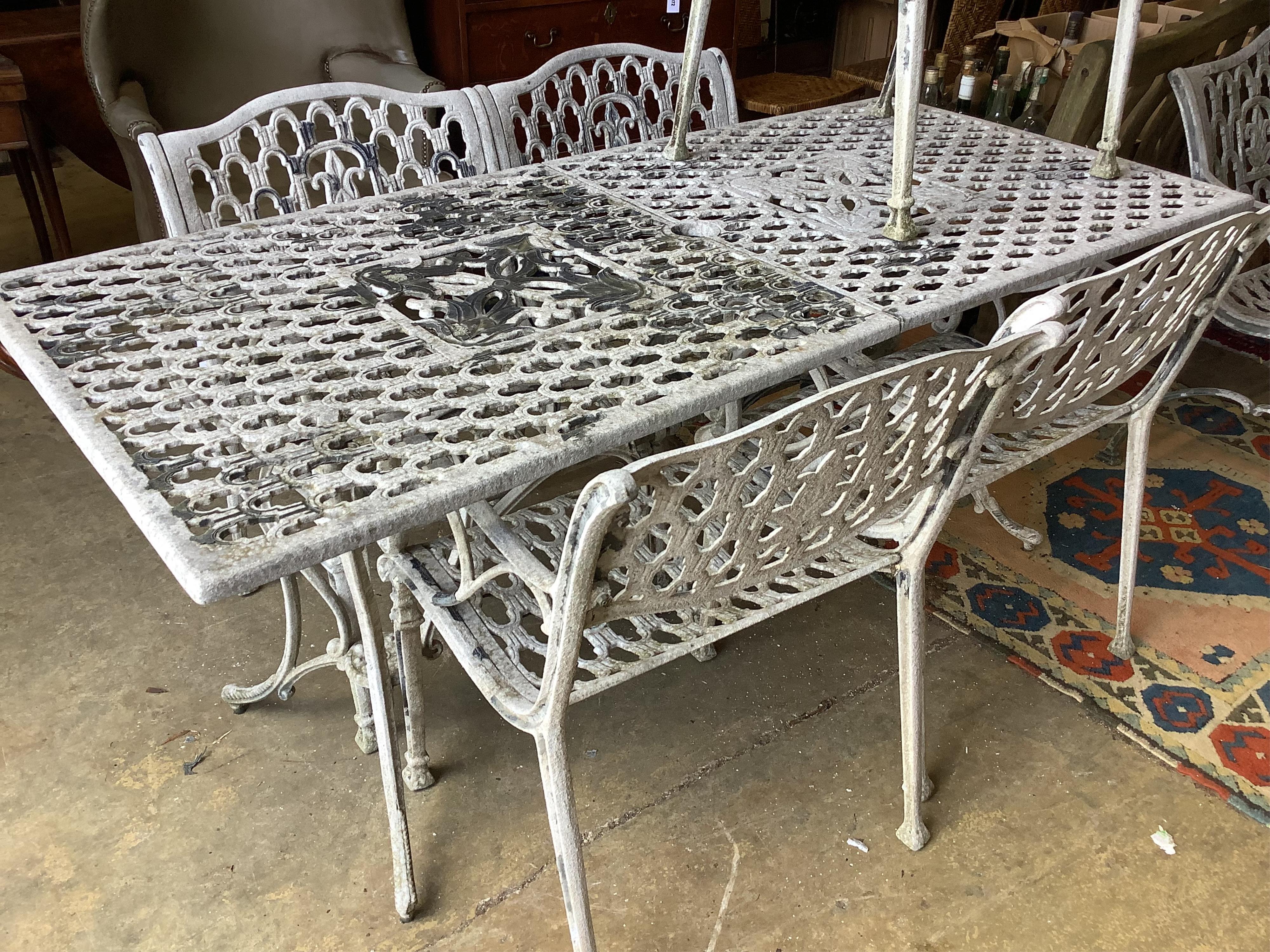 A rectangular painted aluminium garden table, width 177cm, depth 80cm, height 73cm, five matching elbow chairs and bench
